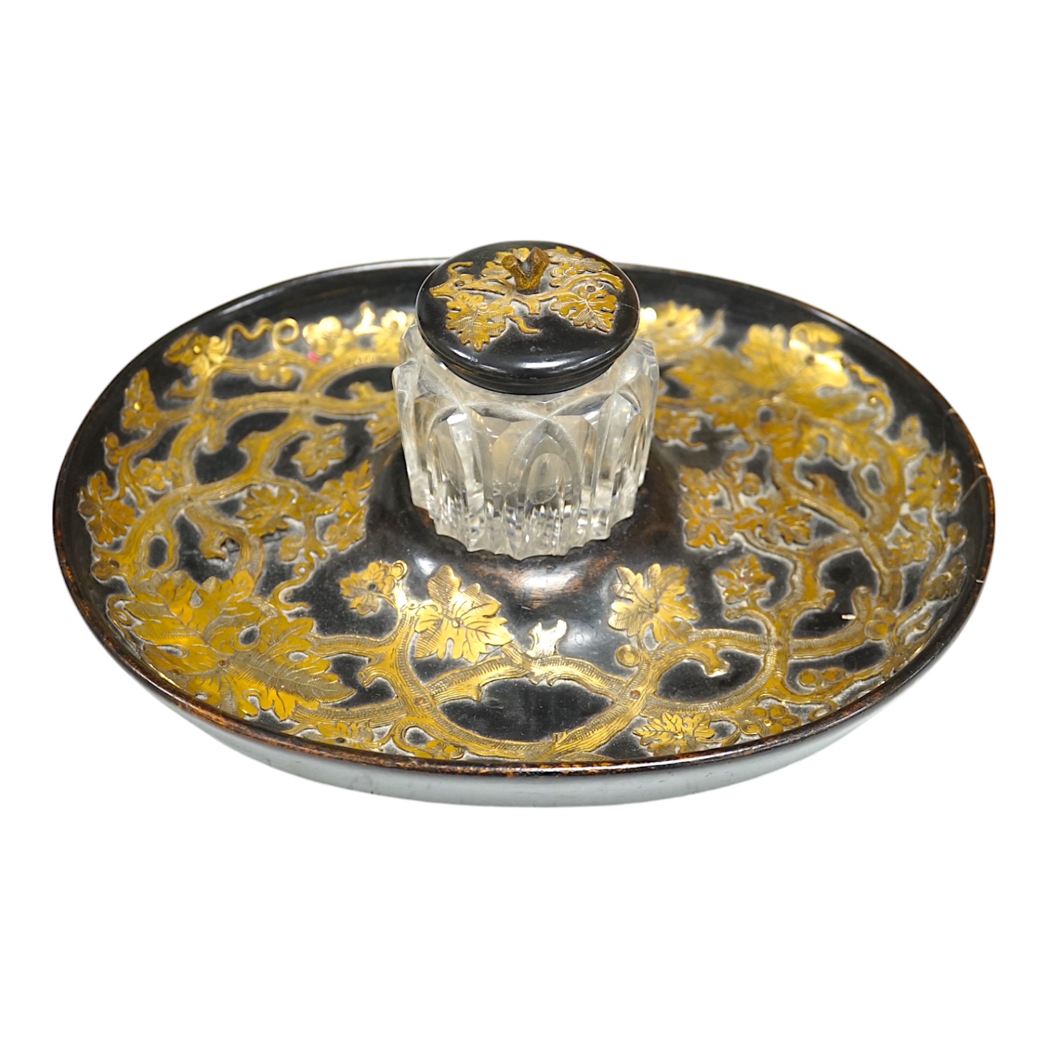 A Victorian ebonised and brass overlaid inkstand with cut glass ink well, 27cm wide. Condition - poor